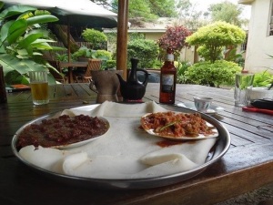 Siga wot and kitfo at Habesha in Kisumu, Kenya, a restaurant with a charming garden setting